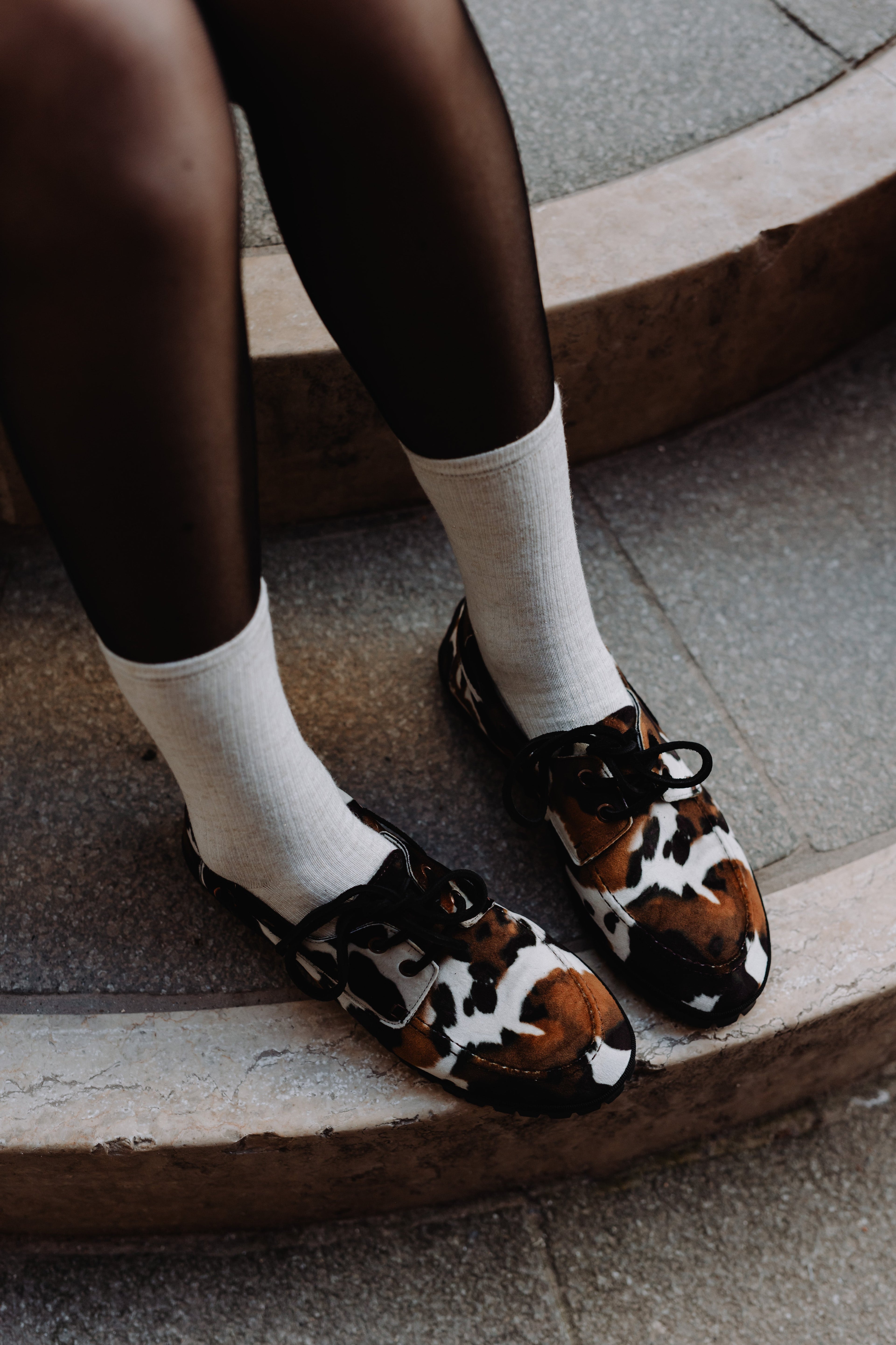 Handcrafted Gondolina Rodeo boat shoes in cow print, featuring authentic Venetian design, lifestyle