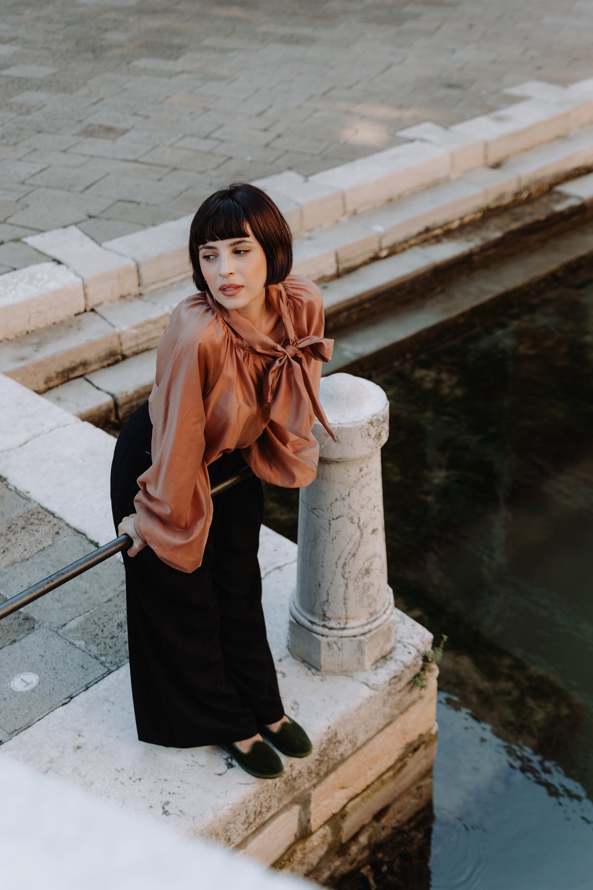 Handcrafted Gondolina Sant Erasmo flats in light green velvet, featuring authentic Venetian design, worn by model