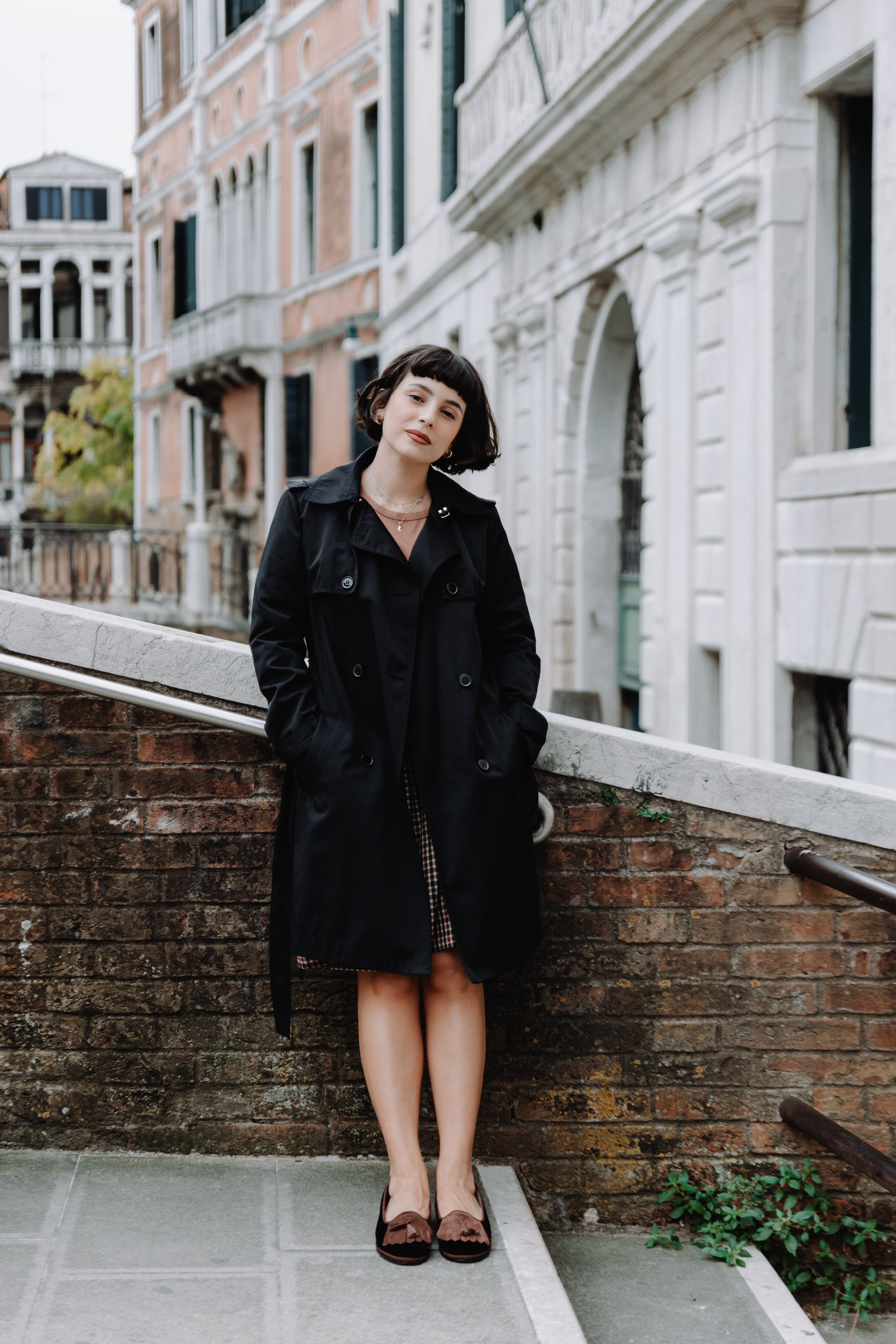 Handcrafted Gondolina Falzarego fringe tassel flats for women in black velvet, featuring authentic Venetian design, worn by model